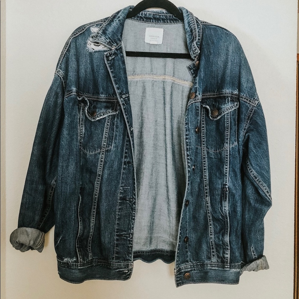 Boyfriend fit distressed denim jacket.